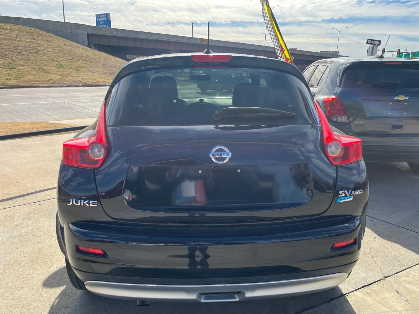 2013 BLACK NISSAN JUKE S; SL; SV; NISM S AWD (JN8AF5MV2DT) with an 1.6L L4 DOHC 16V engine, Continuously Variable Transmission transmission, located at 8101 E. Skelly Dr., Tulsa, OK, 74129, (918) 592-3593, 36.121891, -95.888802 - Photo#4